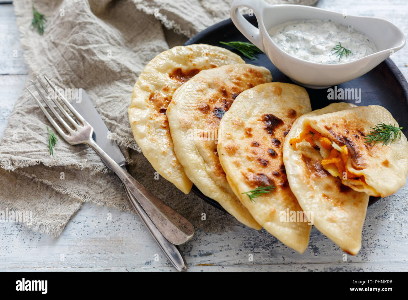Flat bread with pumpkin filling. Azerbaijani cuisine. Stock Photo