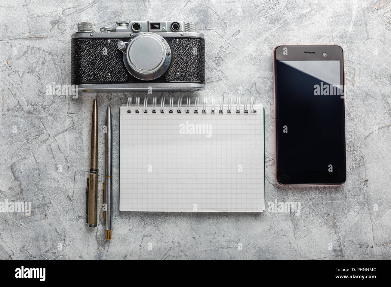 Notebook with film camera Stock Photo Alamy