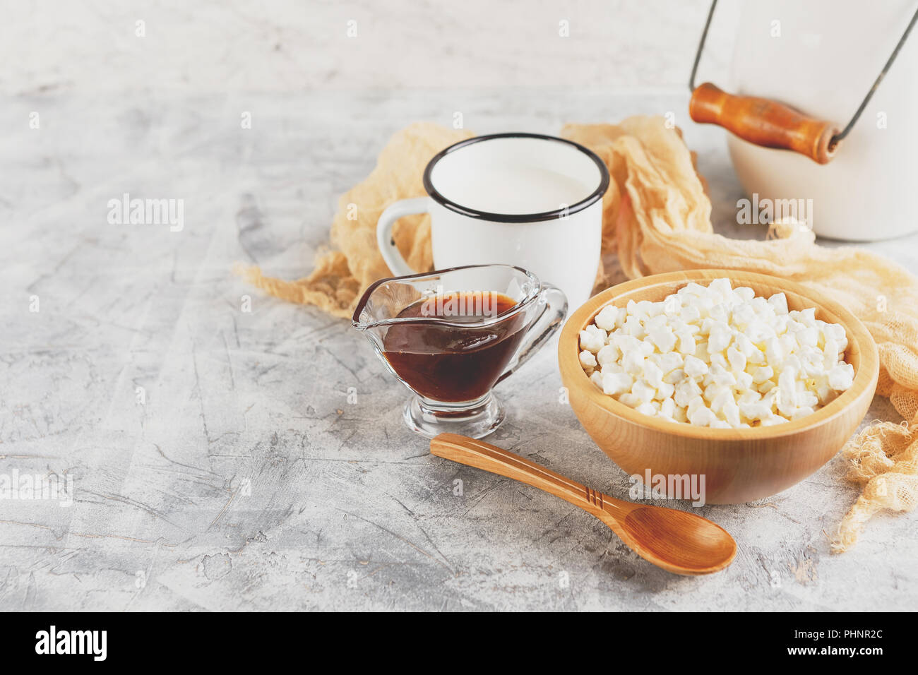 Granulated Cottage Cheese In Wooden Bowl And Mug Of Milk Stock