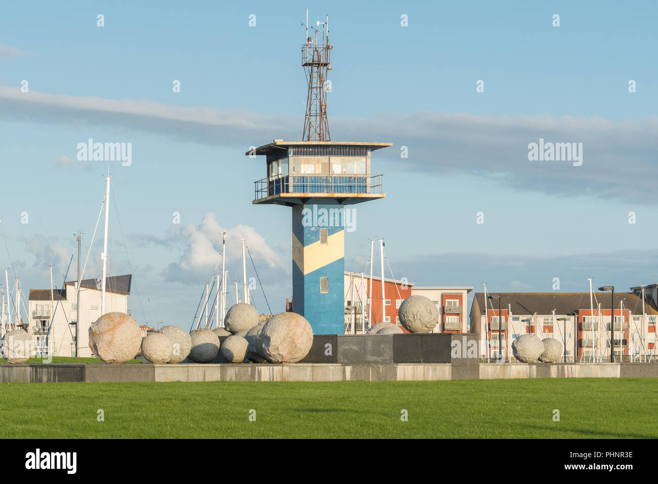 Ardrossan harbour station development - harbour masters watchtower and 'Position and Appearance' granite sphere sculpture, Ardrossan, Scotland, UK Stock Photo