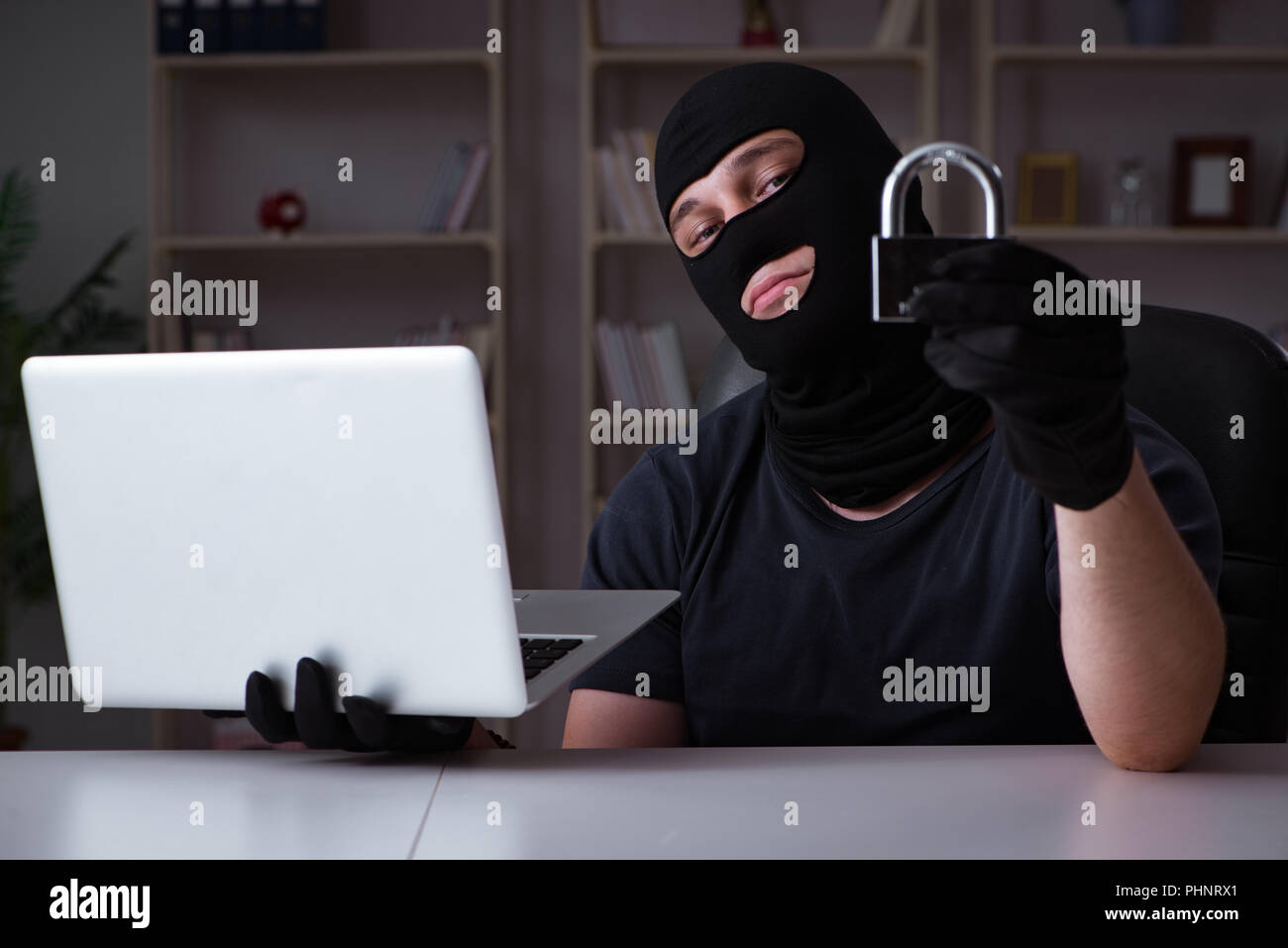 Hacker hacking computer late at night Stock Photo - Alamy