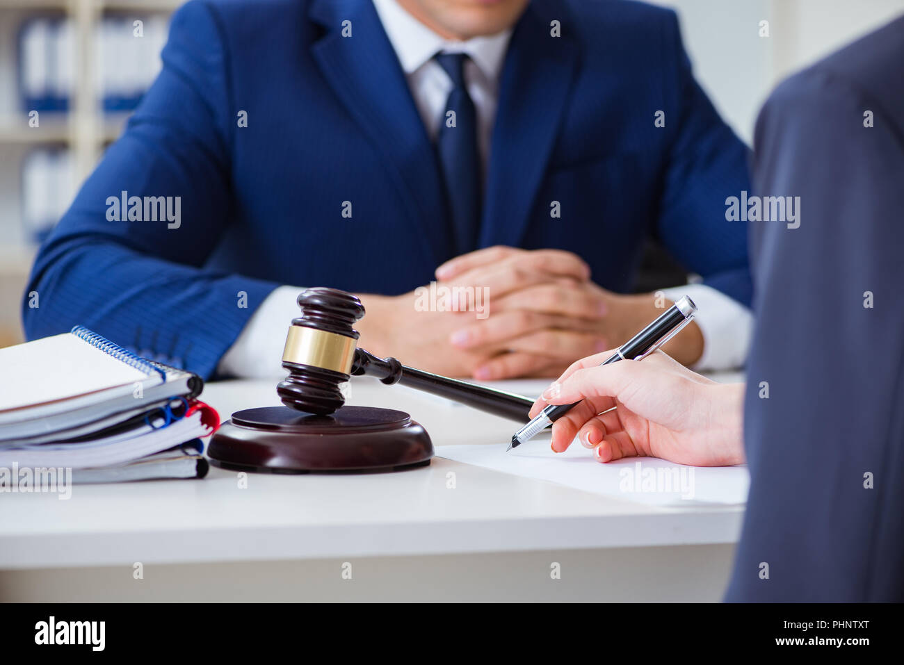 Lawyer talking to his client in office Stock Photo - Alamy
