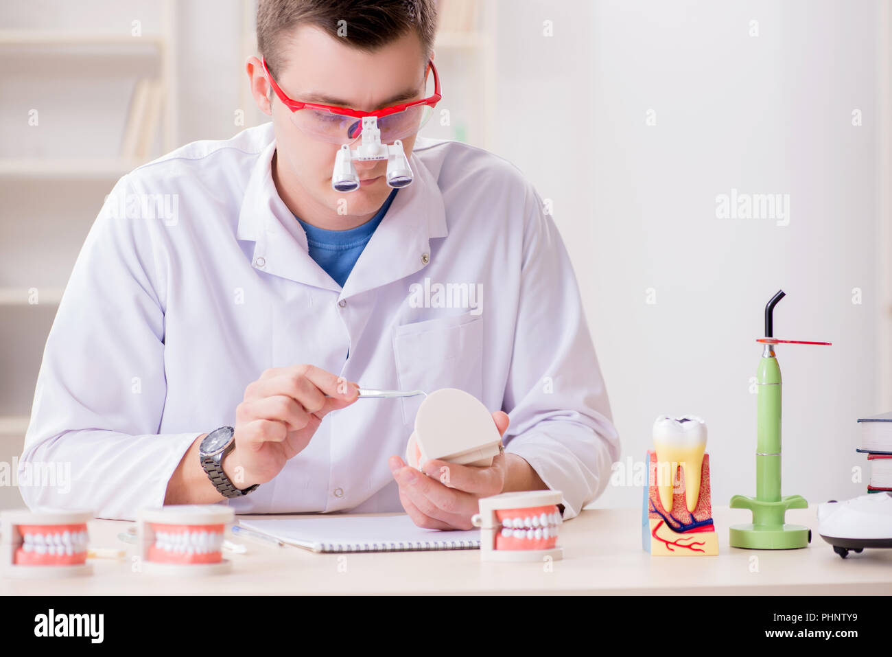 Dentist working teeth implant in medical lab Stock Photo Alamy