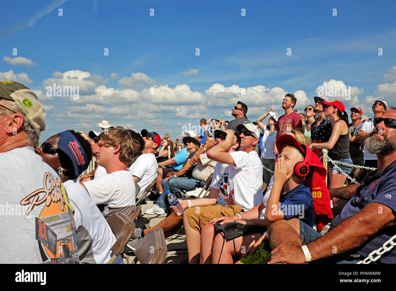 Cleveland, Ohio, USA, 1st Sept, 2018.  Spectators at the 54th Annual Cleveland National Airshow at Burke Lakefront Airport watch the show with some covering their ears from the roar of the planes overhead.  Considered one of the top air shows in the United States, this event is an annual tradition held over the US Labor Day holiday weekend bringing tens of thousands to the shores of Lake Erie to watch the event.  Credit: Mark Kanning/Alamy Live News. Stock Photo
