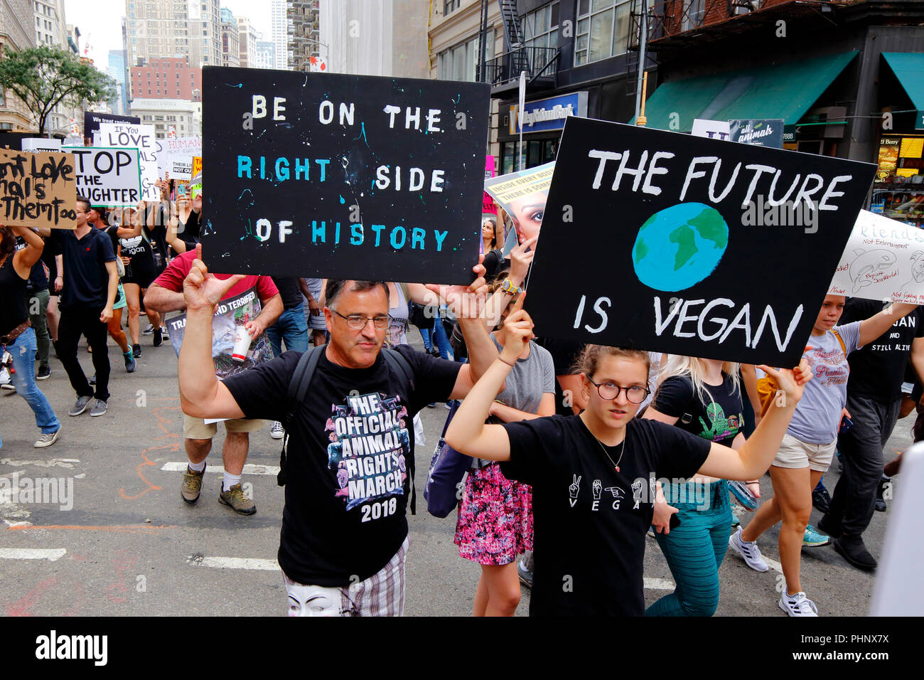 New York, NY, USA. 1st September, 2018. Activists hold signs at the Official Animal Rights March NYC. Stock Photo