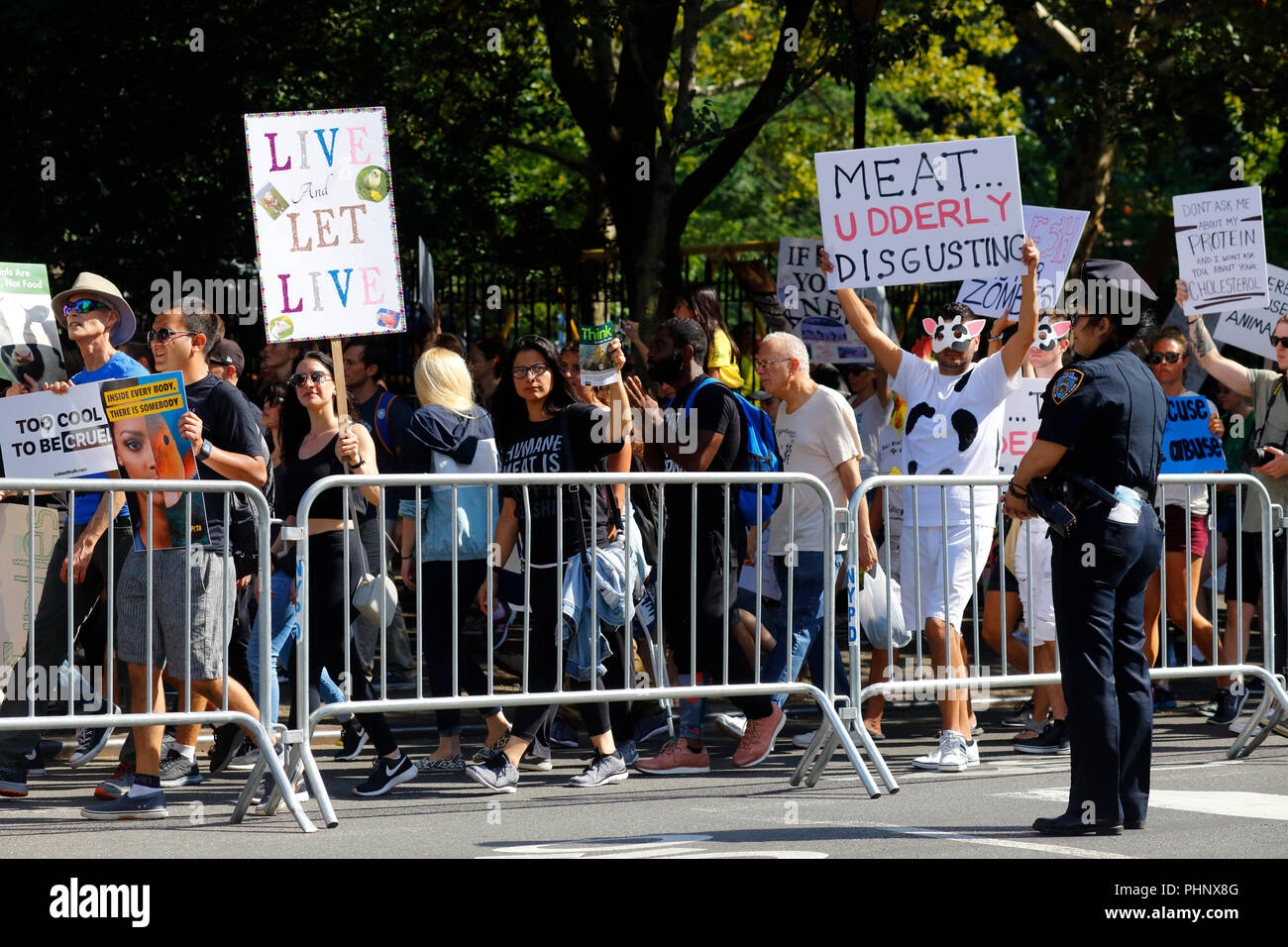 New York, NY, USA. 1st September, 2018. Animal Rights activists file past police during the Official Animal Rights March NYC. Stock Photo