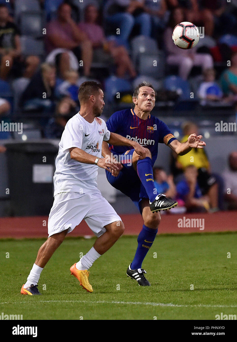 Znojmo, Czech Republic. 31st Aug, 2018. R-L Ion Andomi Goikoetxea (Barcelona) and Radek Sirl (Czech and Slovak team) in action during an exhibition soccer match between former players of FC Barcelona and former players od Czech and Slovak Republic, in Znojmo, Czech Republic, on August 31, 2018. Credit: Lubos Pavlicek/CTK Photo/Alamy Live News Stock Photo