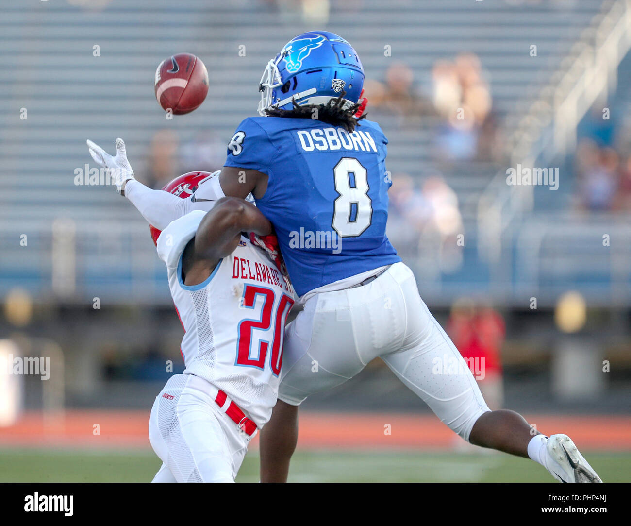 Amherst, USA. 1st September 2018. Buffalo Bulls wide receiver K.J. Osborn (8) goes up to catch a pass against Delaware State Hornets defensive back Keyjuan Selby (20) during the first half of play in the NCAA football game between the Delaware State Hornets and Buffalo Bulls at UB Stadium in Amherst, N.Y. (Nicholas T. LoVerde/Cal Sport Media) Credit: Cal Sport Media/Alamy Live News Stock Photo