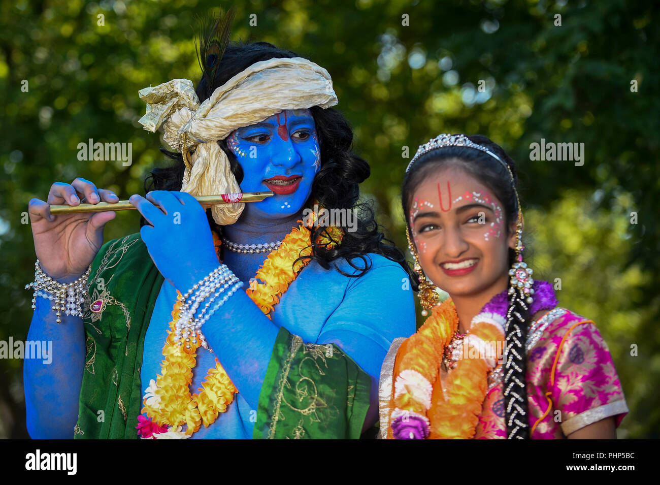 Watford, UK. 2 September 2018. (L to R) Kushal and Shivanee, students at Avanti School in Stanmore, dress as Lord Krishna and his consort Radharani, as thousands of devotees attend the biggest Janmashtami festival outside of India at the Bhaktivedanta Manor Hare Krishna Temple in Watford, Hertfordshire.  The event celebrates the birth of Lord Krishna and take place at a property donated to the Hare Krishna movement by ex Beatle George Harrison.  Credit: Stephen Chung / Alamy Live News Stock Photo