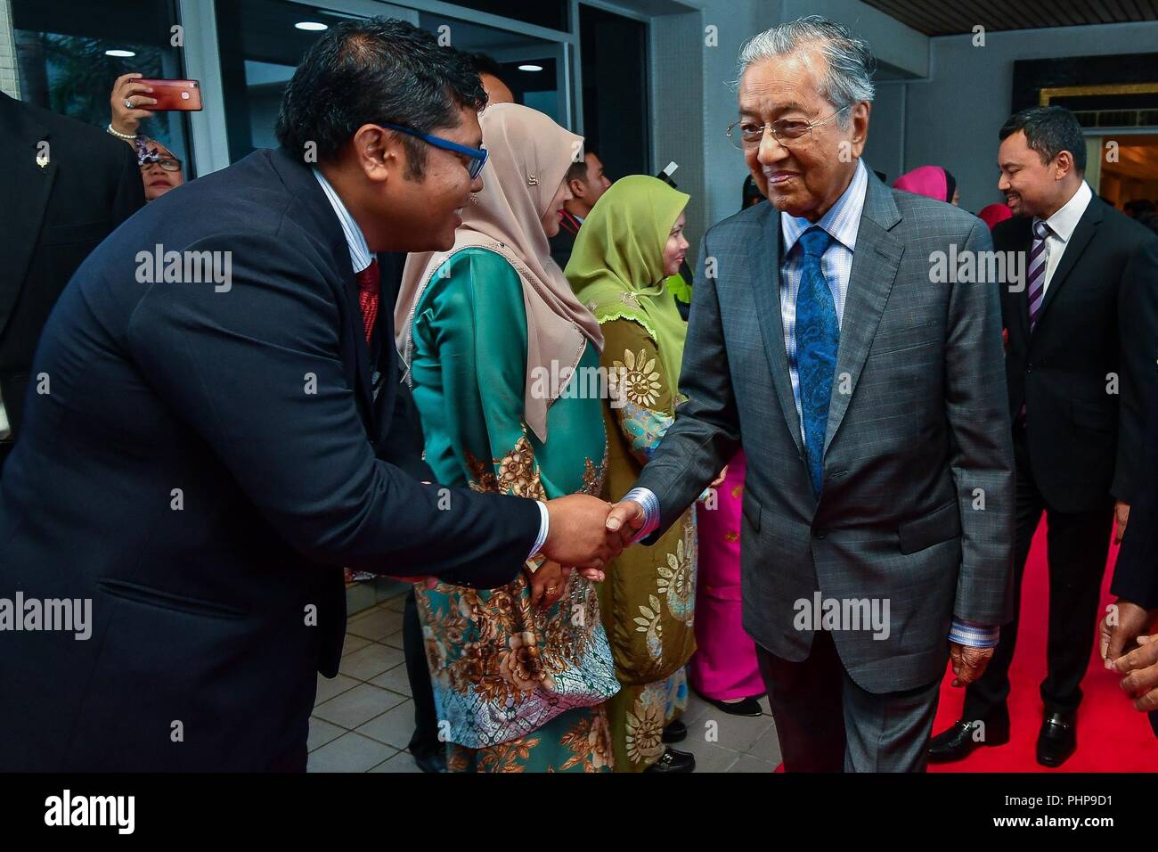 Brunei. 2 September 2018. shows Malaysian Prime Minister Mahathir Mohamad (R) arrives at Brunei international airport and shakes hands with an official in Bandar Seri Begawan, capital of Brunei. Malaysian Prime Minister Mahathir Mohamad touched down in Brunei on Sunday afternoon for a two-day official visit to further strengthen bilateral relations and cooperation with the sultanate.(Xinhua) Credit: Xinhua/Alamy Live News Stock Photo