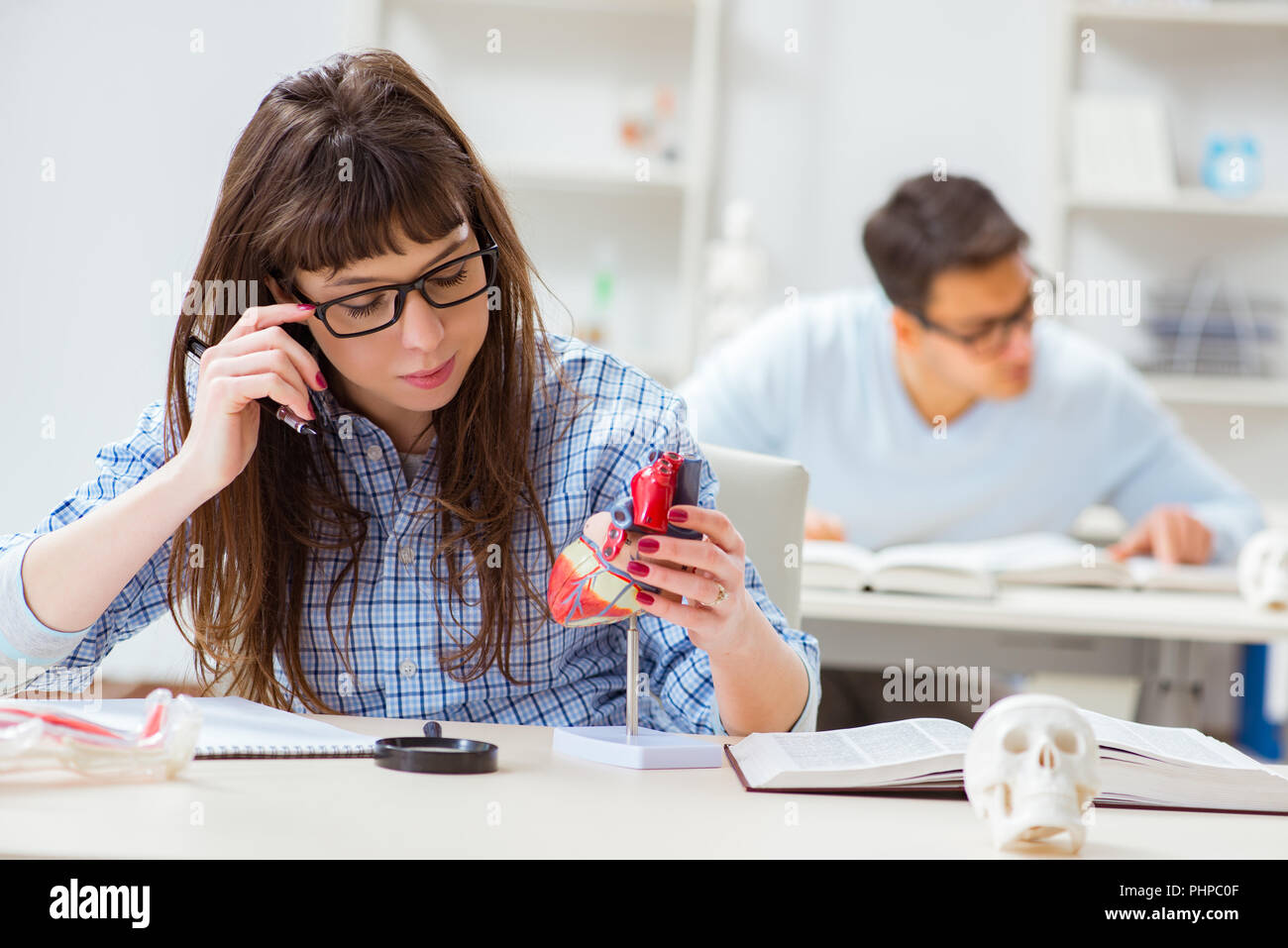 Two medical students studying in classroom Stock Photo Alamy