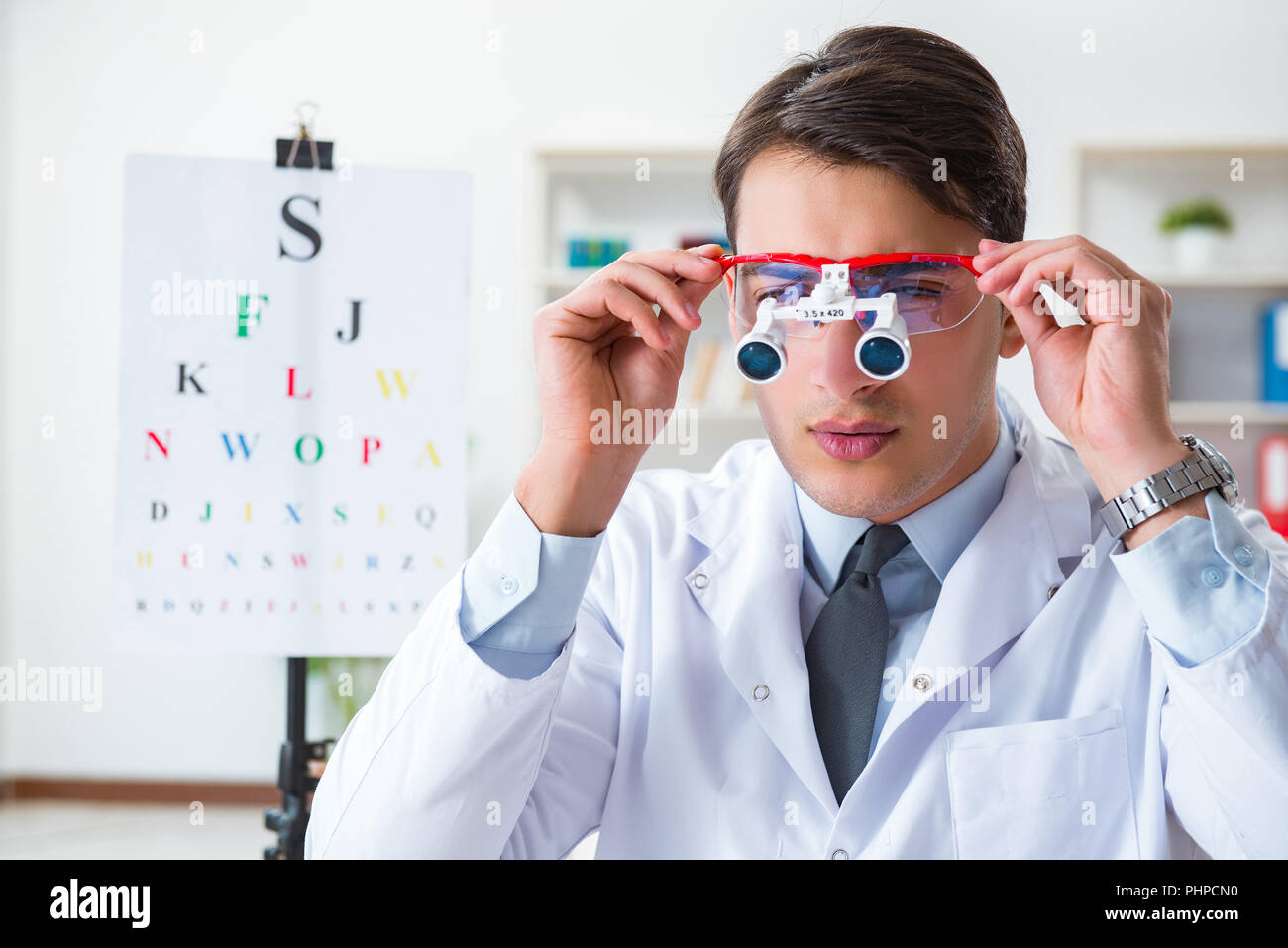 Eye doctor in eyecare concept in hospital Stock Photo Alamy
