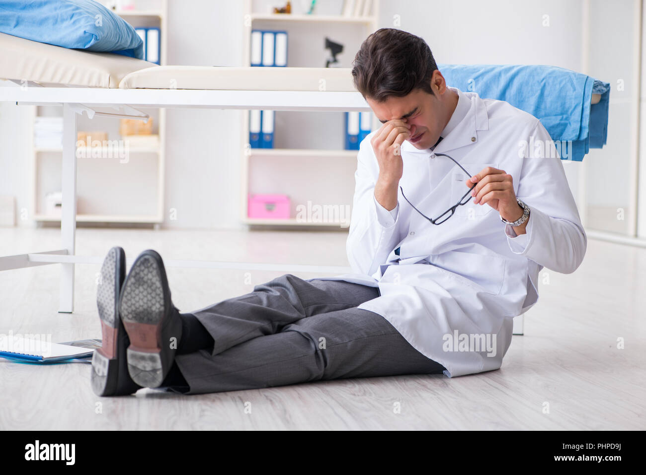 Sad surgeon sitting on floor hi-res stock photography and images - Alamy