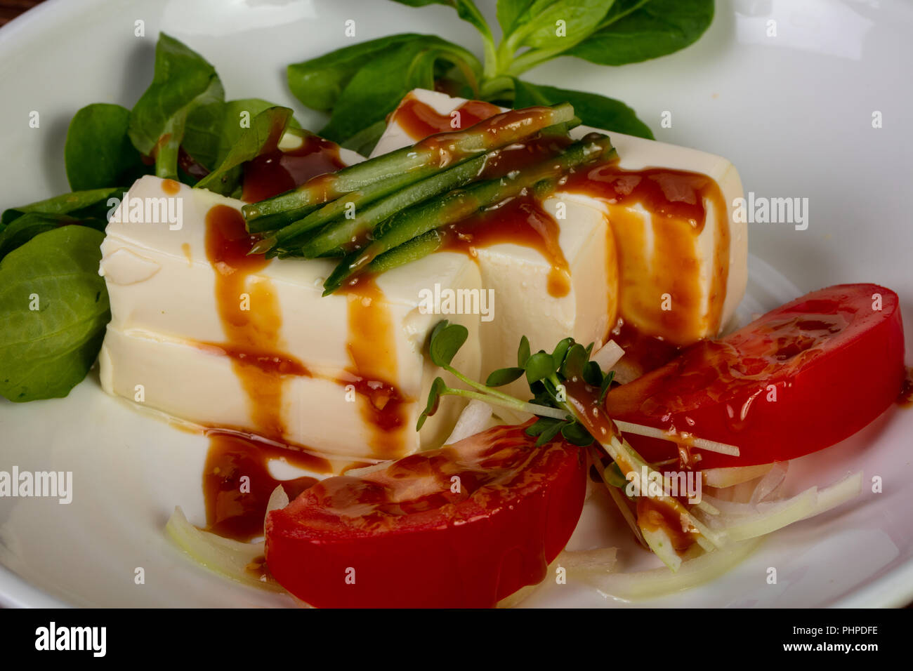 Japanese Tofu cheese with sauce and vegetables Stock Photo Alamy