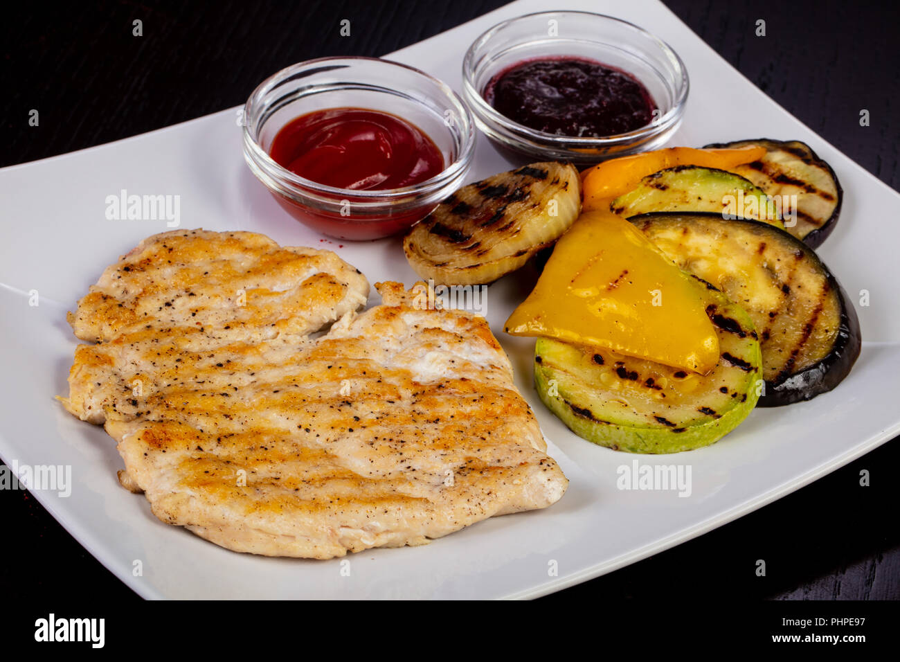 Tasty grilled chicken stake and vegetables Stock Photo Alamy