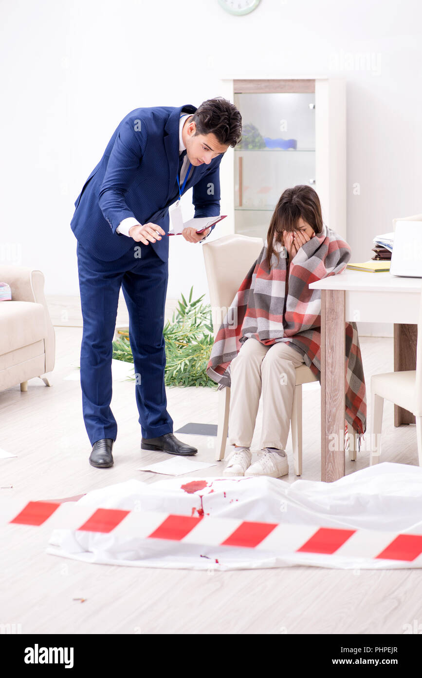 Victim wife at the scene on murder Stock Photo