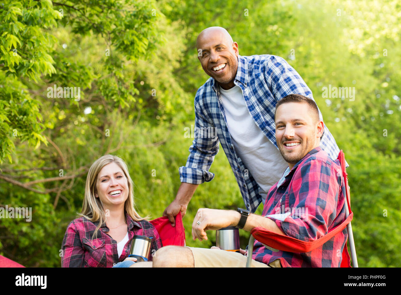 Group of friends laughing and talking. Stock Photo