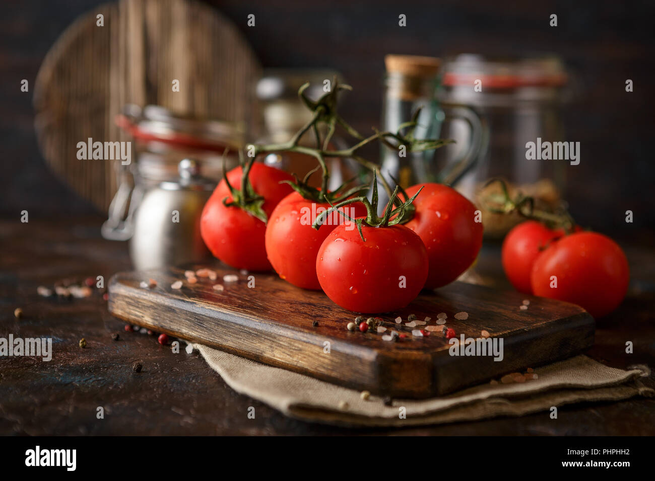 Cutting board with cherry tomatoes Stock Photo - Alamy