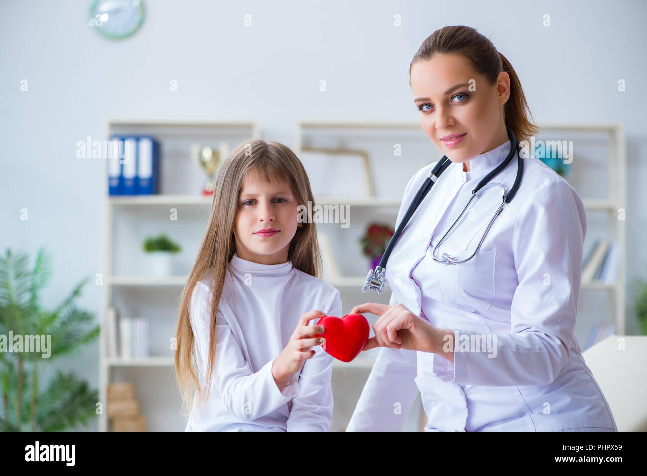 Female doctor pediatrician checking girl Stock Photo Alamy