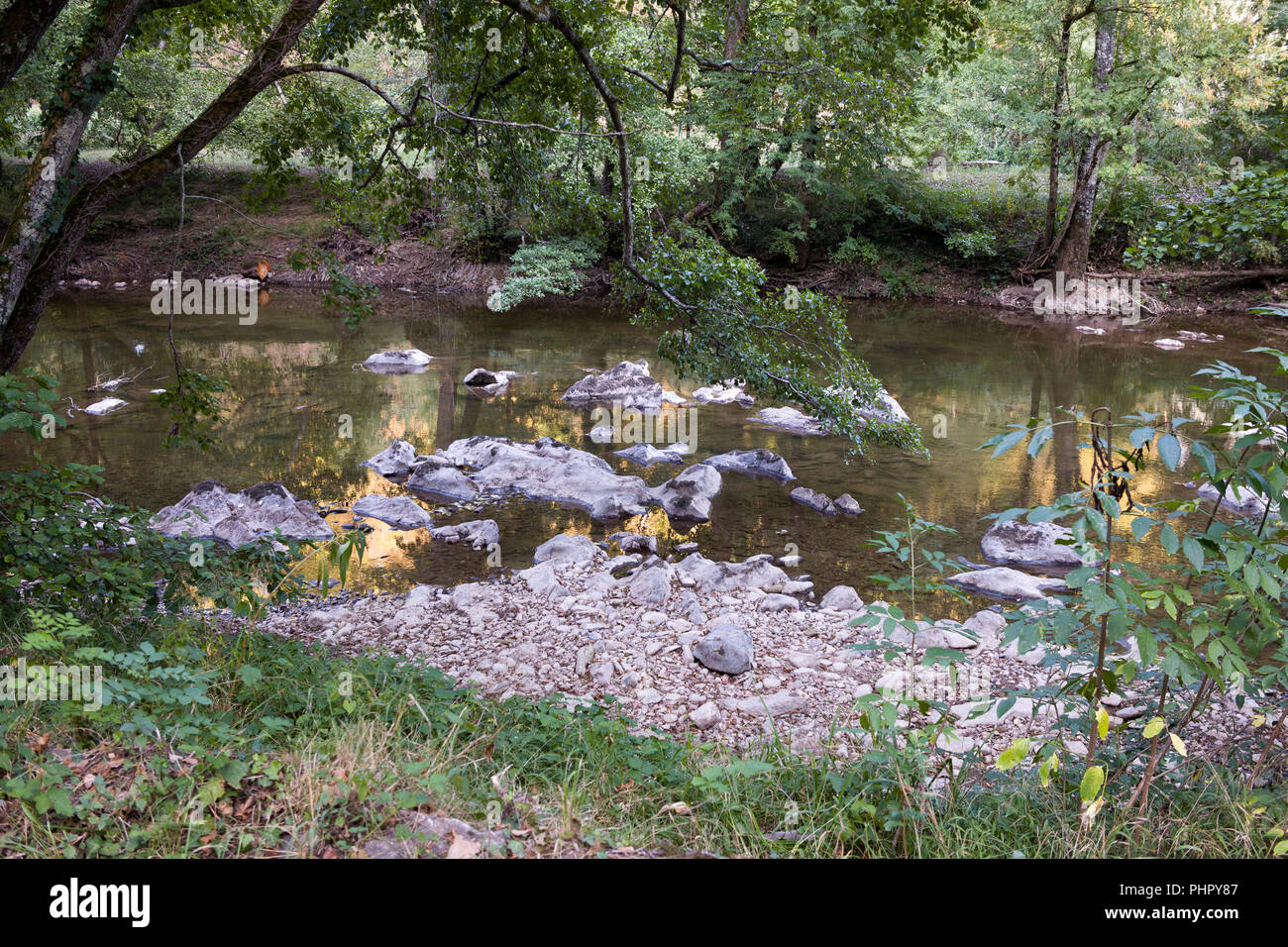 Rocks uncovered on be riverbed of the Aveyron river after a long drought in Laguépie, Tarn et Garonne, Occitanie, France at the beginning of September Stock Photo
