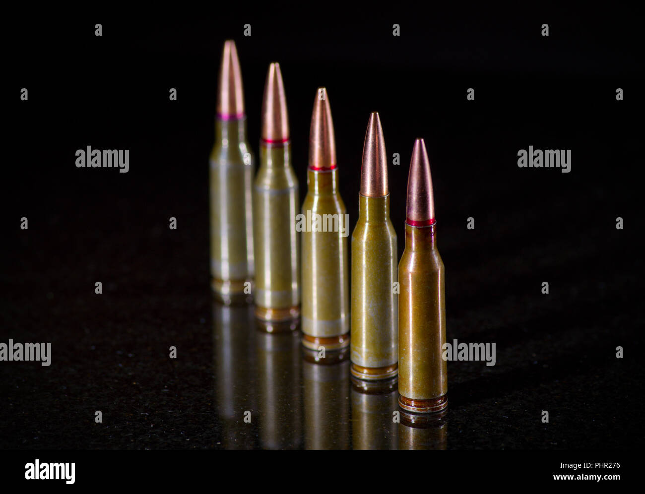 Ammunition cartridges on black background Stock Photo