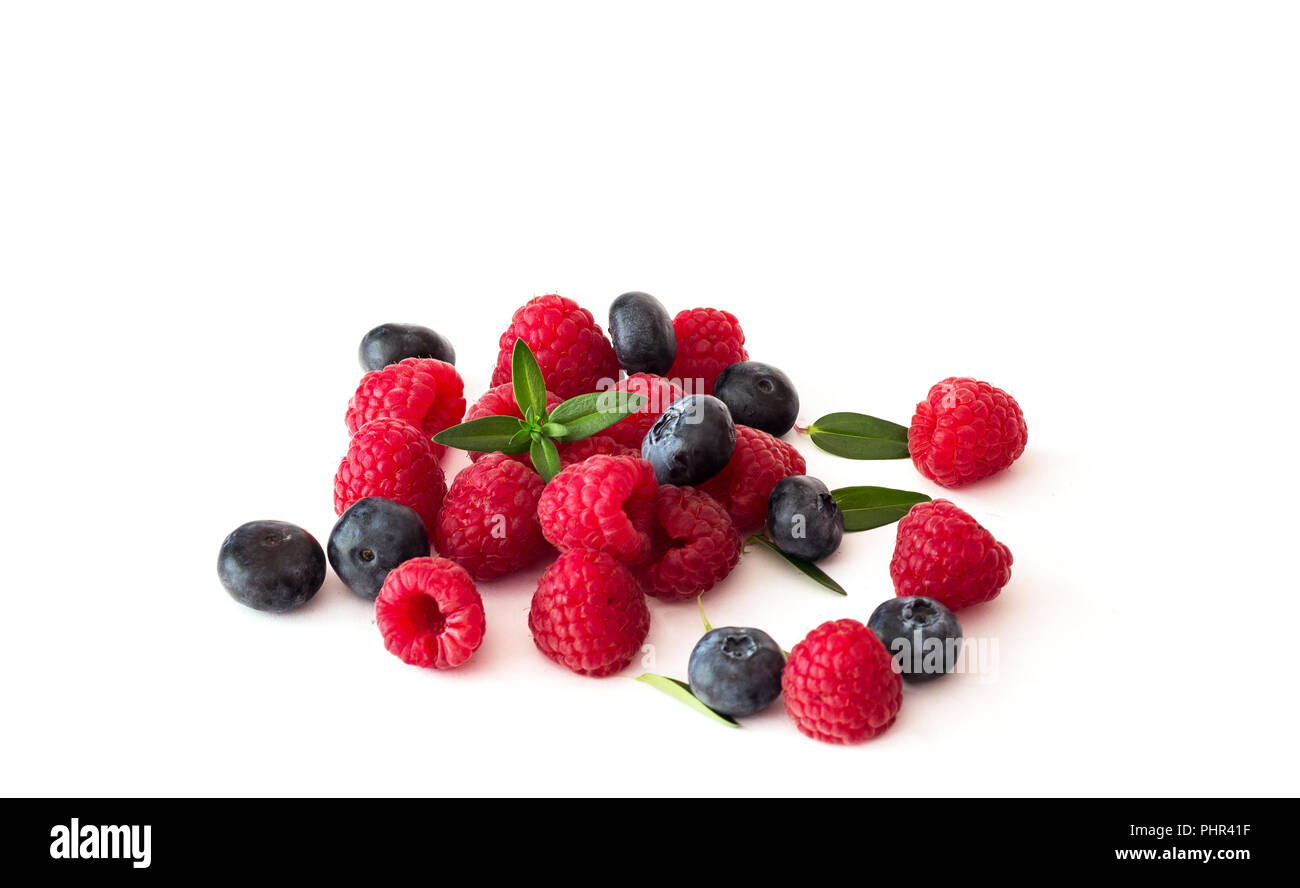 Blueberries and raspberries on white background Stock Photo Alamy