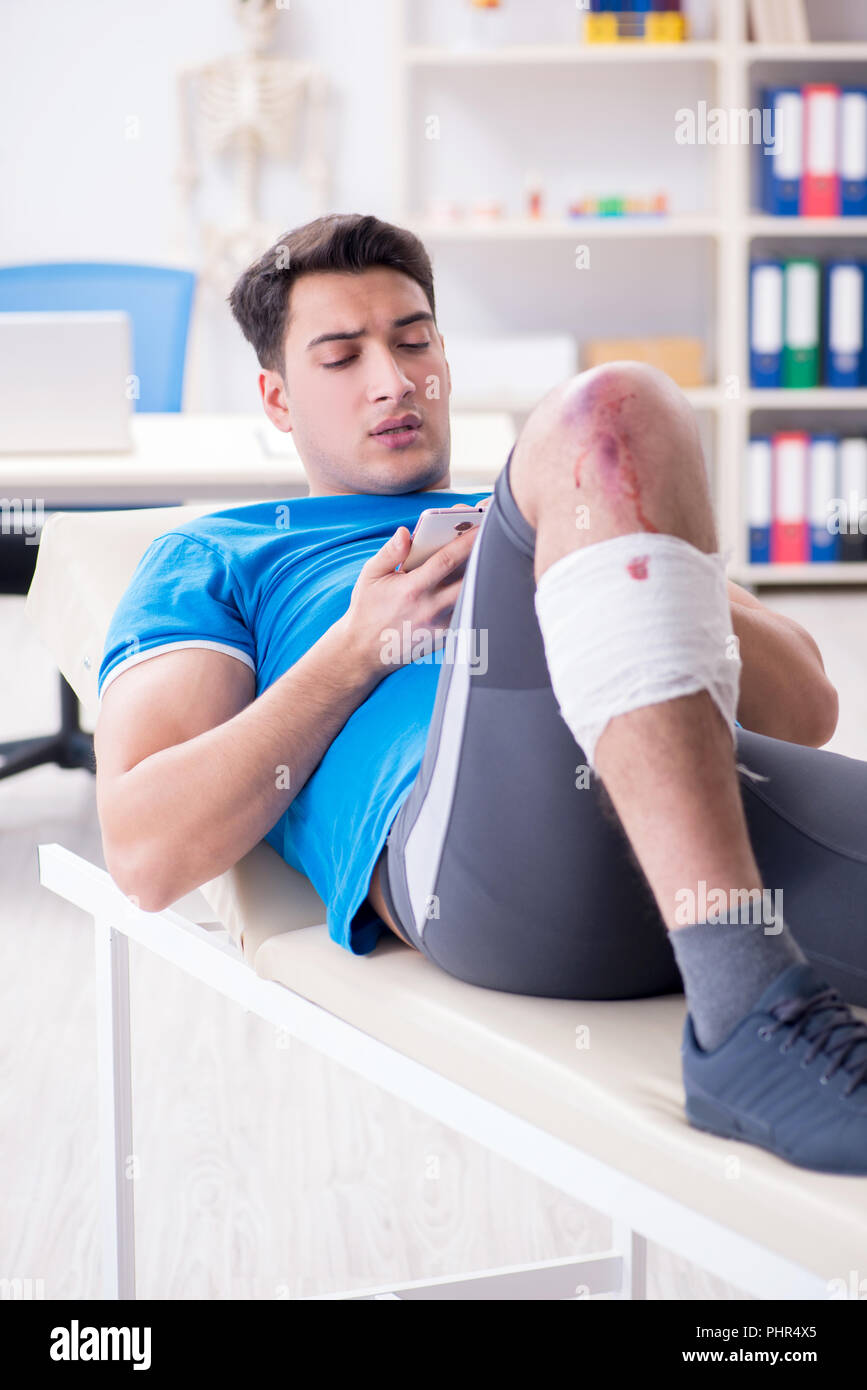 Patient visiting doctor after sustaining sports injury Stock Photo Alamy