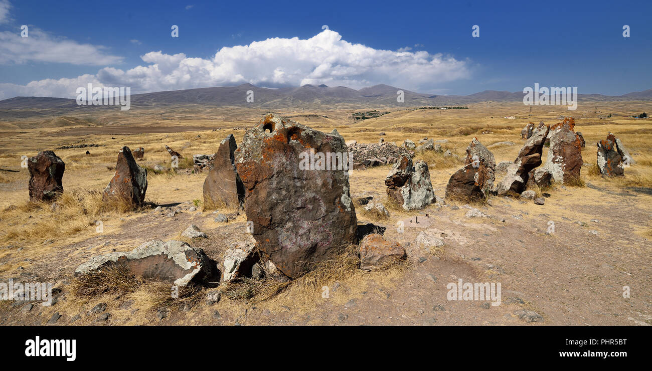 Tourist take photo in ancient observatory called Zorats Karer or Karahunj near Sisian city, Armenian Stonehenge. Prehistoric archaeological megalithic Stock Photo