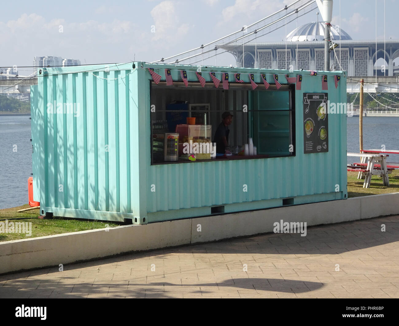 Food and drinks shop made from refurbish shipping container. Stock Photo