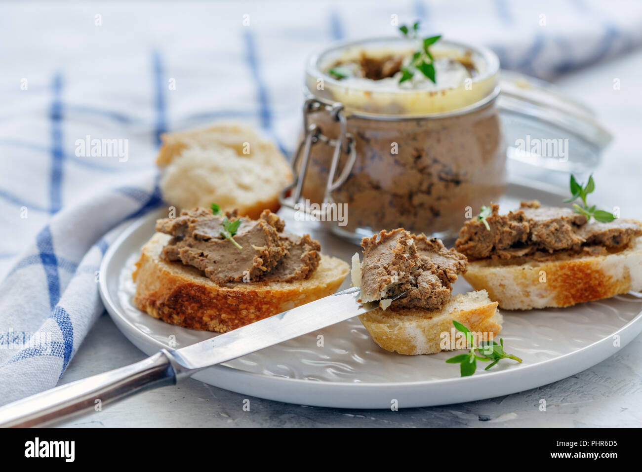 Baguette slices with homemade beef liver pate. Stock Photo