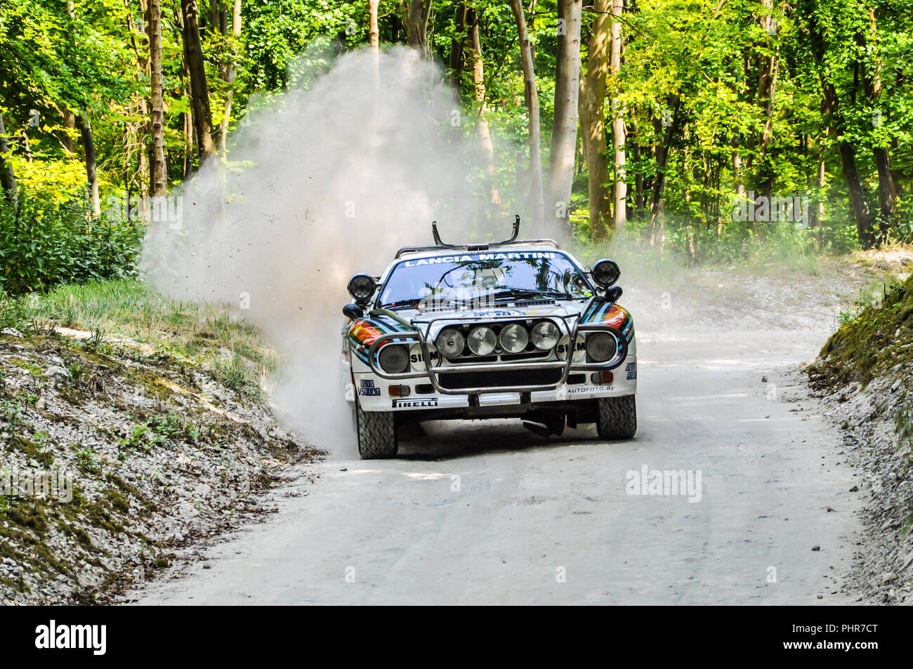 1983 MARTINI Racing Lancia 037 on the Forest Rally Stage at the Goodwood Festival of Speed. Classic rally car kicking up dust on stage Stock Photo