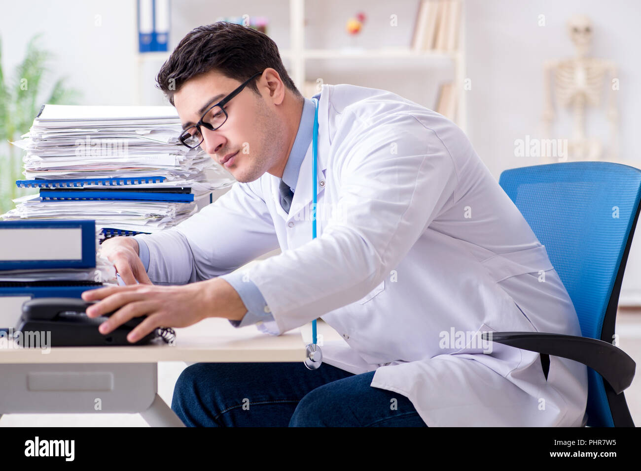 Busy doctor with too much work in hospital Stock Photo Alamy