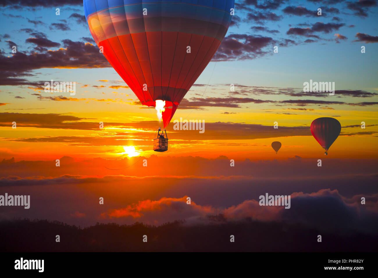 Beautiful balloons in the sky at sunset, Bali Stock Photo