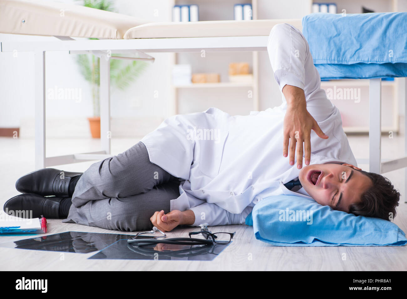 Doctor sleeping on floor after long night shift Stock Photo - Alamy