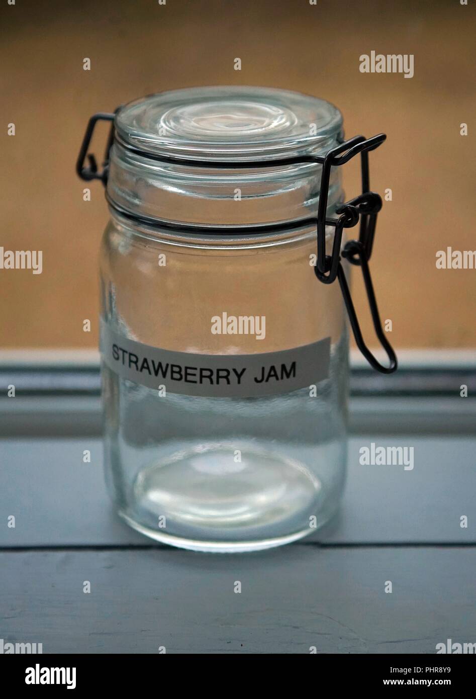 Empty Glass Jam Jar container with seal and label Strawberry Jam Stock