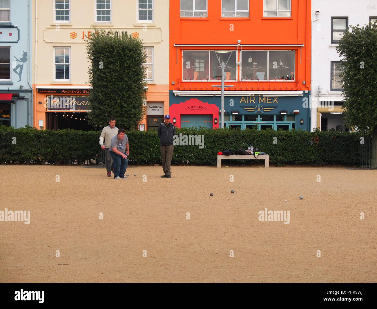 Members of the Liberation Petanque Club playing petanque on a public pitch at Weighbridge Gardens St Helier Jersey Channel Islands Stock Photo