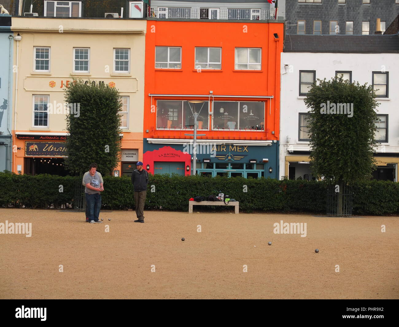 Members of the Liberation Petanque Club playing petanque on a public pitch at Weighbridge Gardens St Helier Jersey Channel Islands Stock Photo