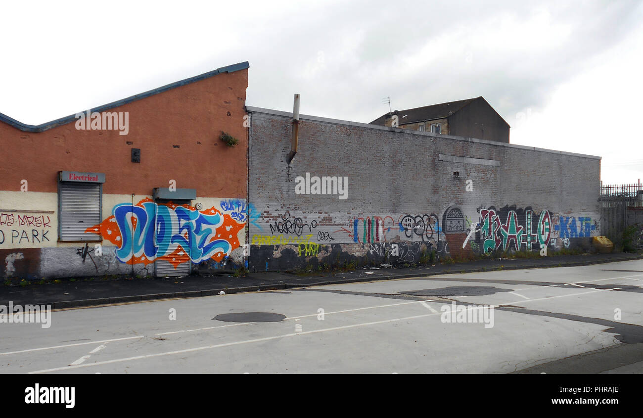 Some street art and graffiti sprayed and painted on to a wall in