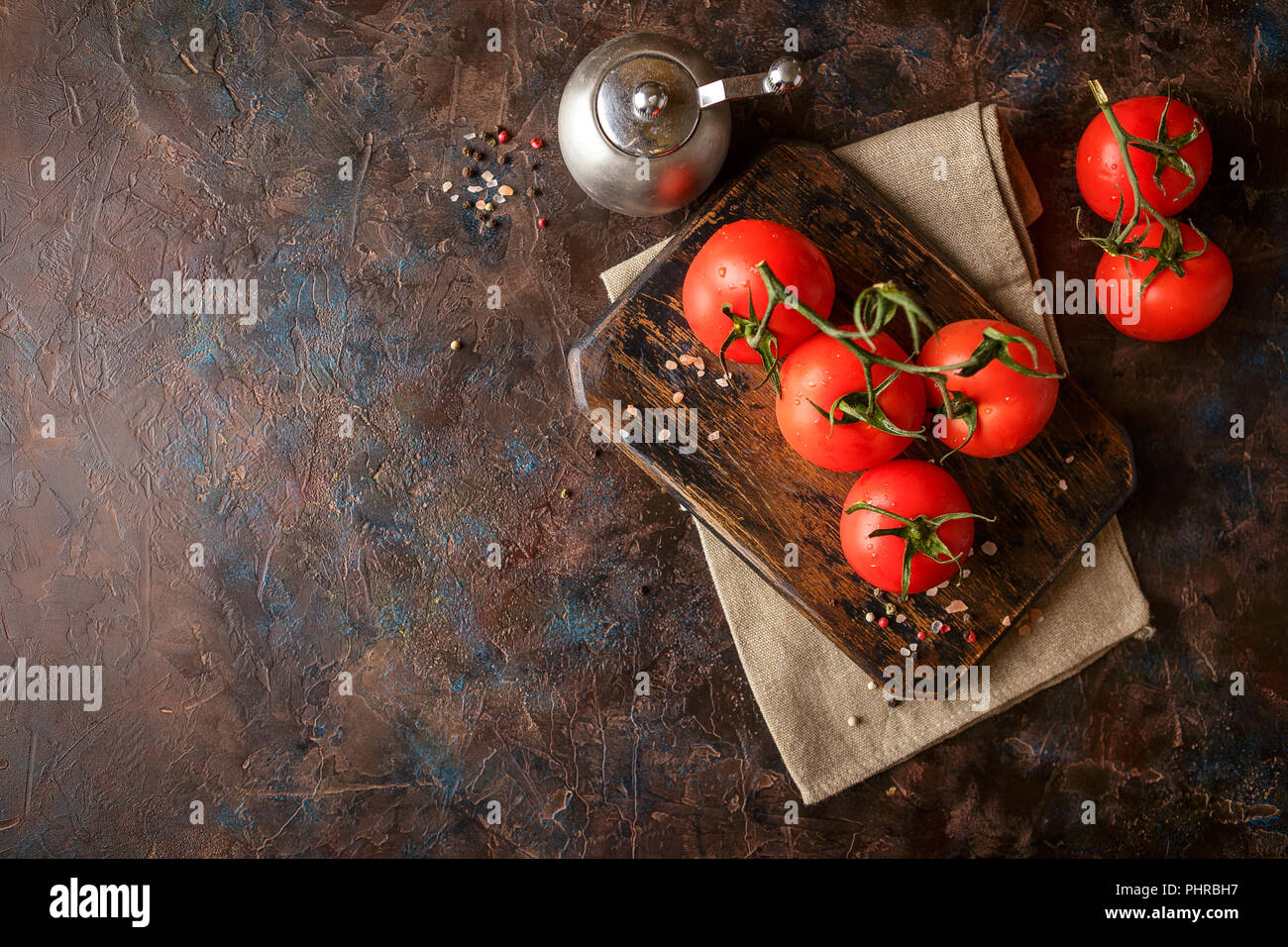 Cutting board with cherry tomatoes Stock Photo - Alamy
