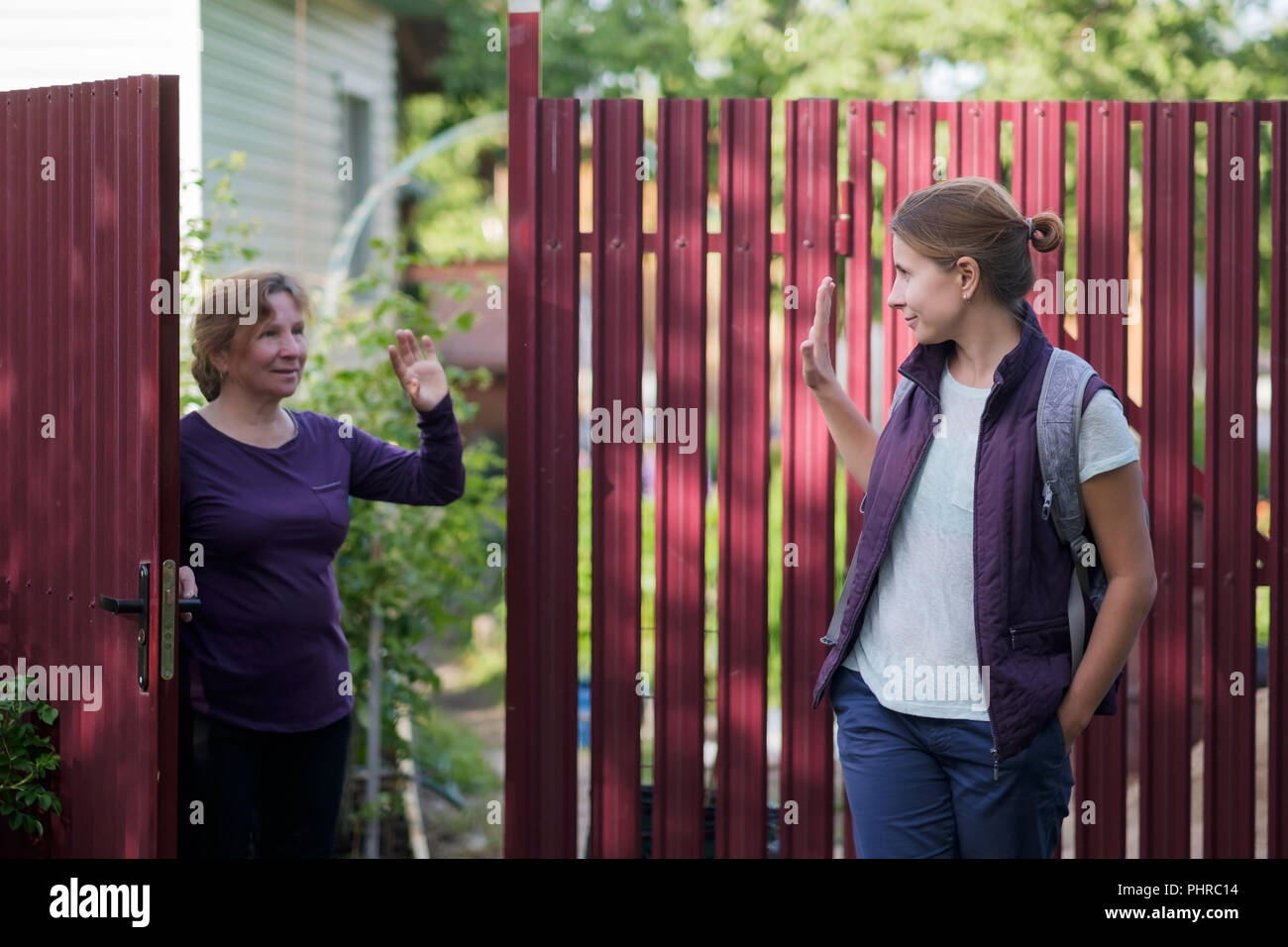 caucasian-mother-saying-goodbye-to-her-daughter-as-she-are-leaving-stock-photo-alamy