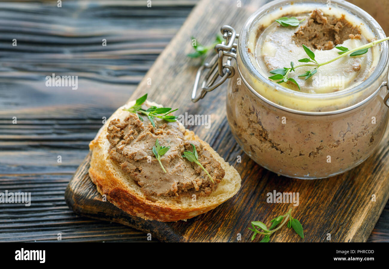 Piece of baguette with homemade liver pate. Stock Photo