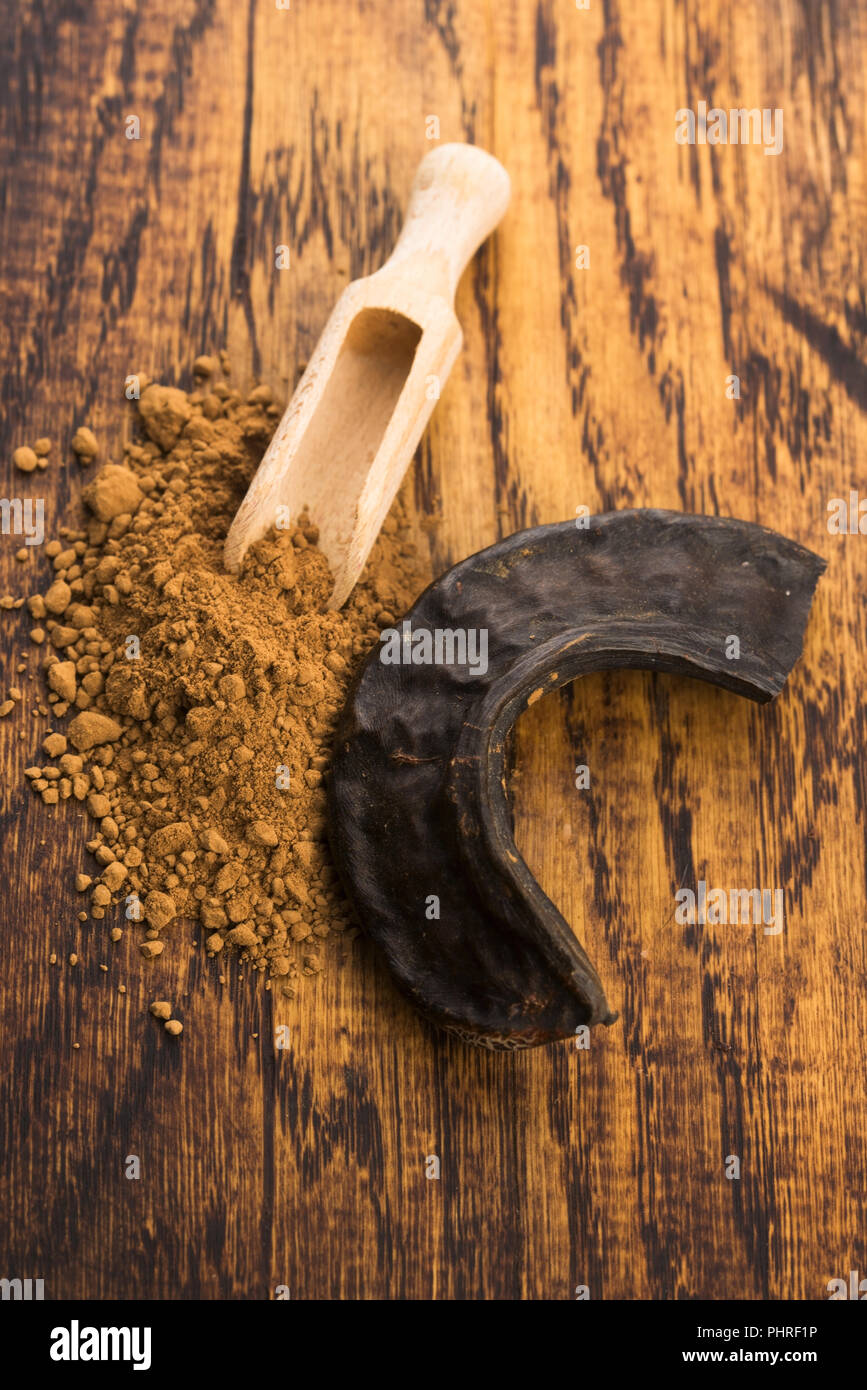 carob pods and carob powder Stock Photo Alamy