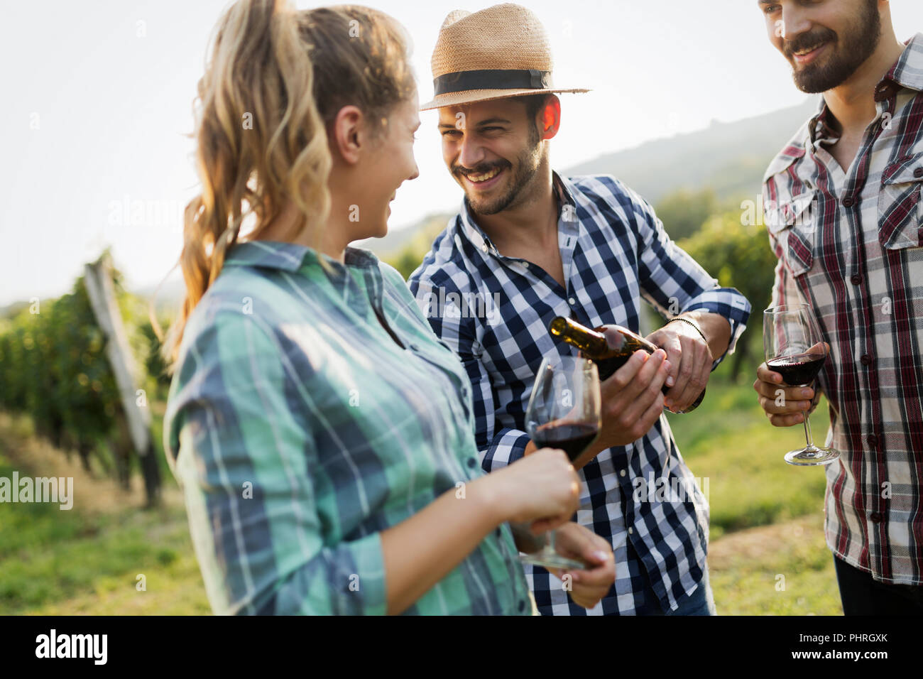 People tasting wine in vineyard Stock Photo - Alamy
