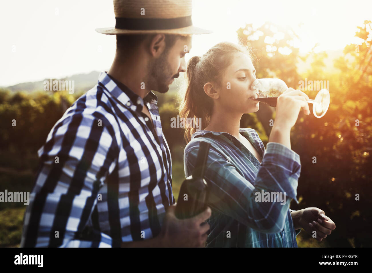 People tasting wine in vineyard Stock Photo - Alamy
