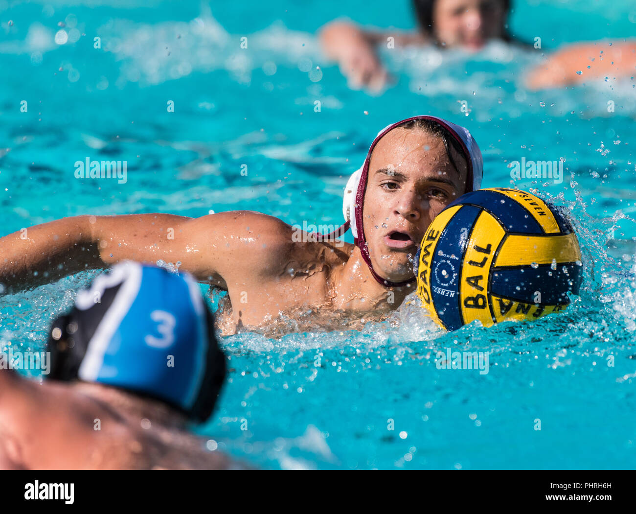 Buena High School's water polo player keeps eyes on Foothill Technology's defender while moving