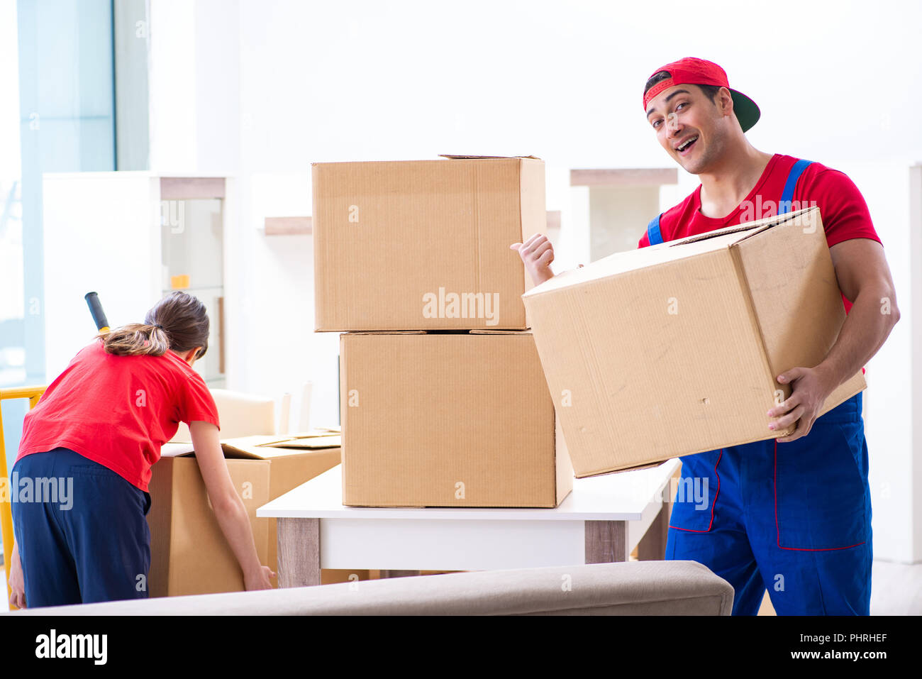 Professional movers doing home relocation Stock Photo