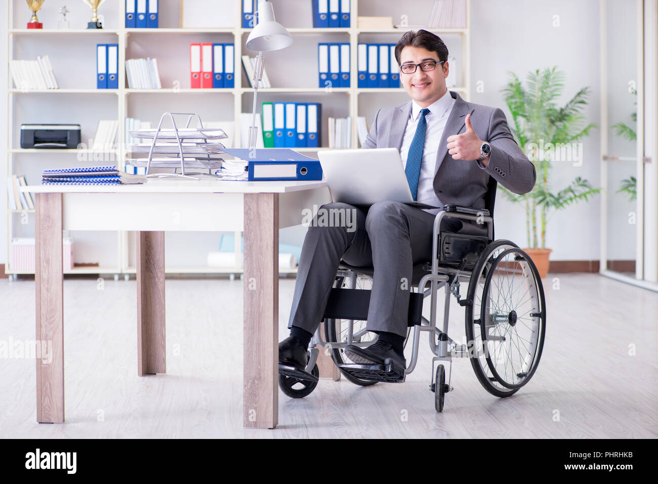 Disabled businessman working in the office Stock Photo