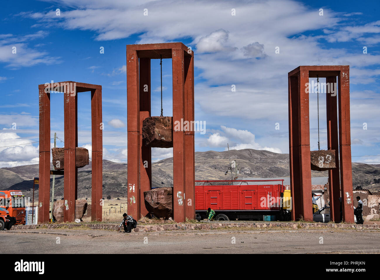 Artistic sculpture of three massive hanging rock blocks, at the entrance to Tiwanaku archaeological site, near La Paz, Bolivia Stock Photo