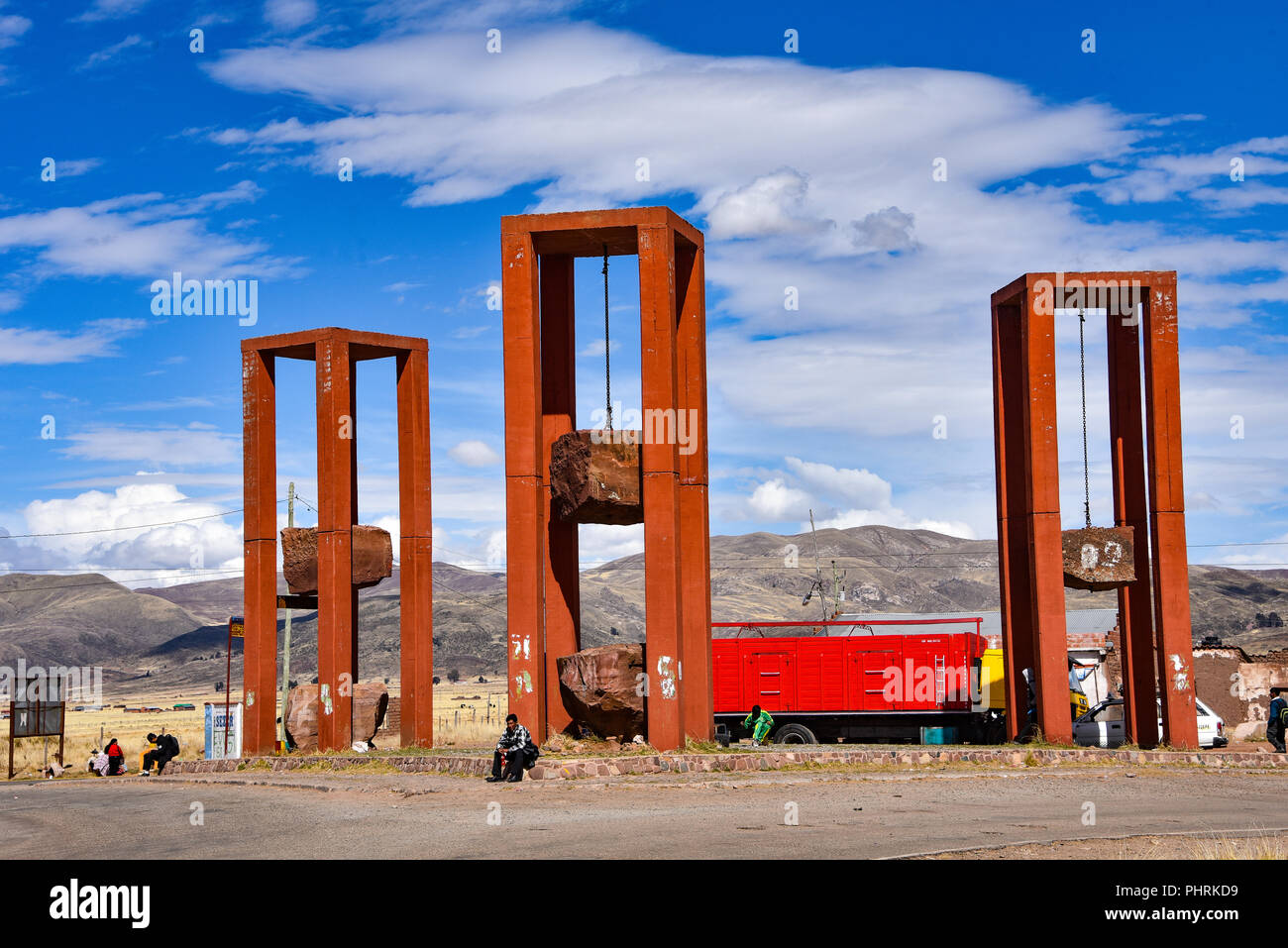 Artistic sculpture of three massive hanging rock blocks, at the entrance to Tiwanaku archaeological site, near La Paz, Bolivia Stock Photo