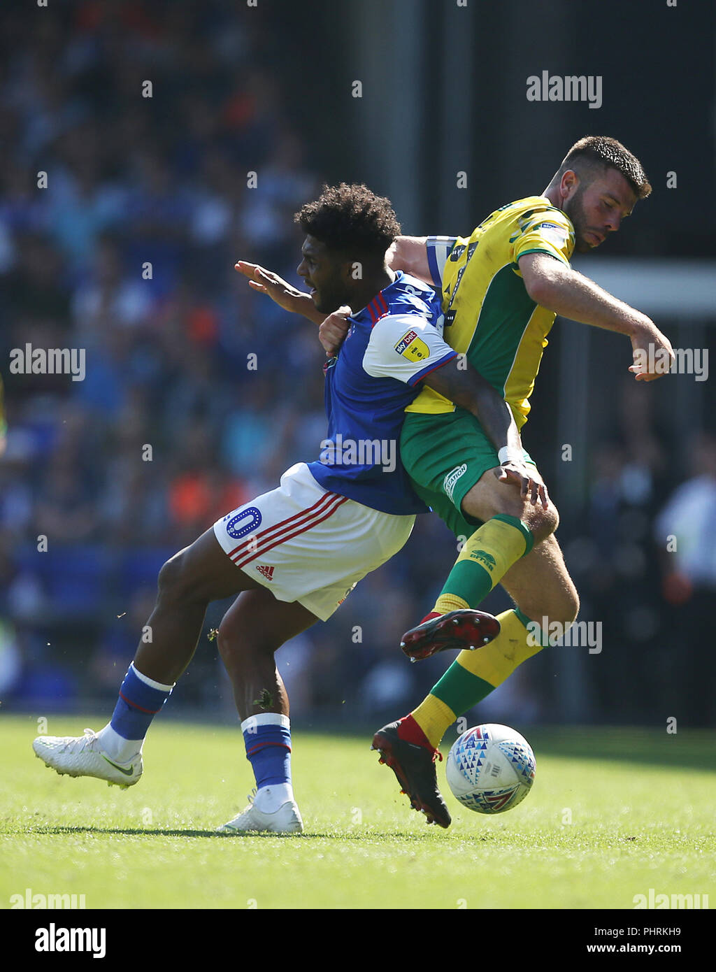 Norwich City's Grant Hanley (right) and Ipswich Town's Ellis Harrison in action during the Sky Bet Championship match at Portman Road, Ipswich. PRESS ASSOCIATION Photo. Picture date: Sunday September 2, 2018. See PA story SOCCER Ipswich. Photo credit should read: Steven Paston/PA Wire. RESTRICTIONS: EDITORIAL USE ONLY No use with unauthorised audio, video, data, fixture lists, club/league logos or "live" services. Online in-match use limited to 120 images, no video emulation. No use in betting, games or single club/league/player publications. Stock Photo